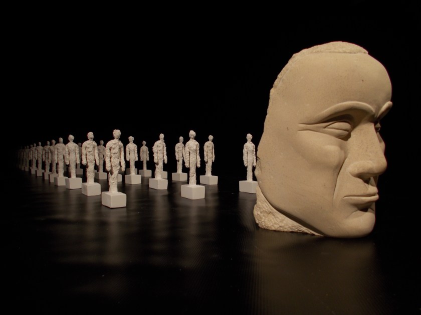 Male head which is part of the same work.