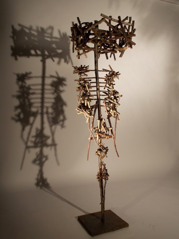 Large Upright figure made from branches.